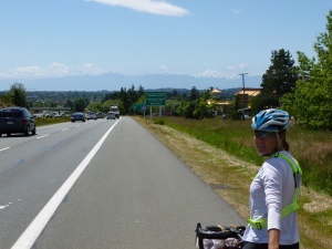 Cycling into Victoria with Washington Cascades in the background.